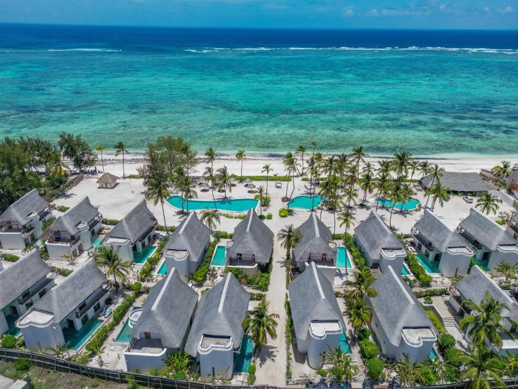 an aerial view of a resort on the beach at Natural Park Villa Resort in Pingwe