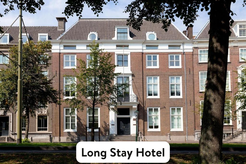 a large brick building with the words long stay hotel at Staybridge Suites The Hague - Parliament, an IHG Hotel in The Hague