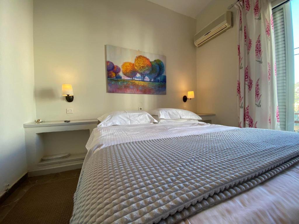 Łóżko lub łóżka w pokoju w obiekcie Zoe Pension
