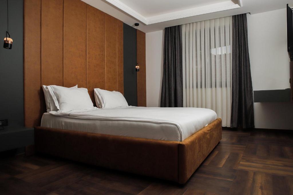 Postel nebo postele na pokoji v ubytování Triumf Hotel