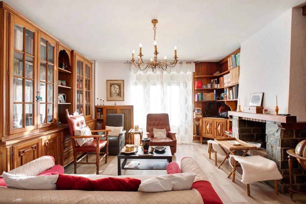 a living room with a couch and a fireplace at Vanna House in Saint Vincent