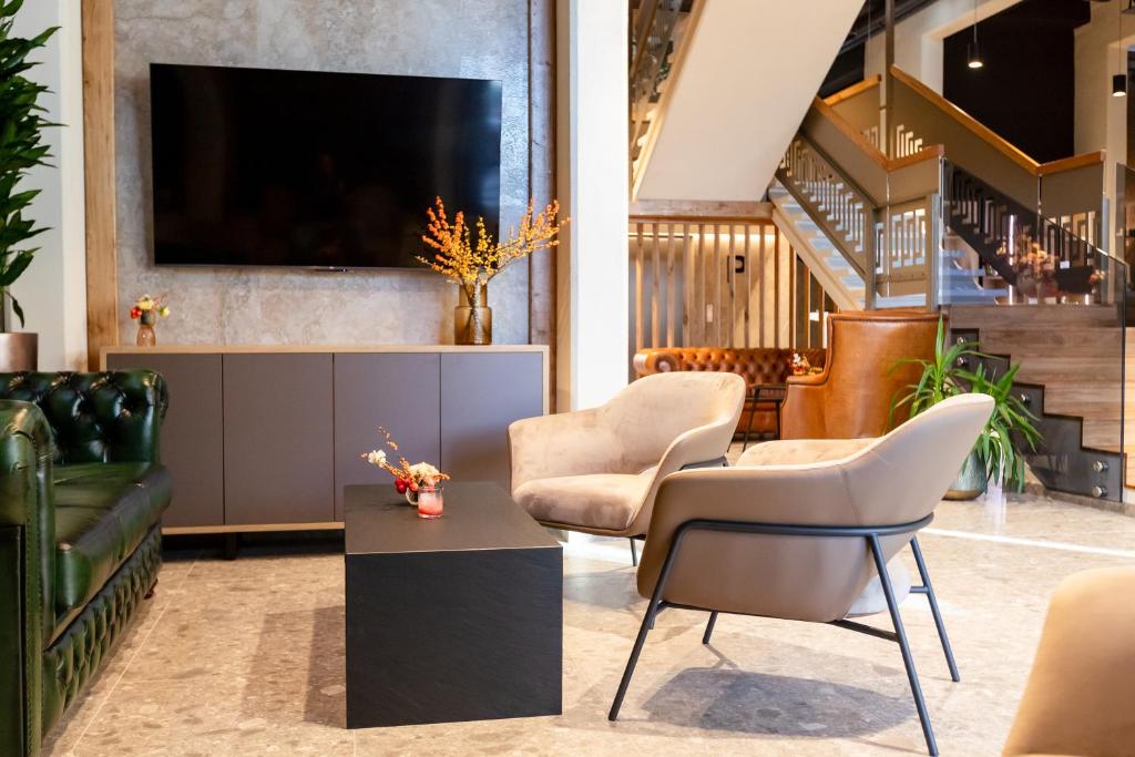 TV a/nebo společenská místnost v ubytování Hotel Lonca