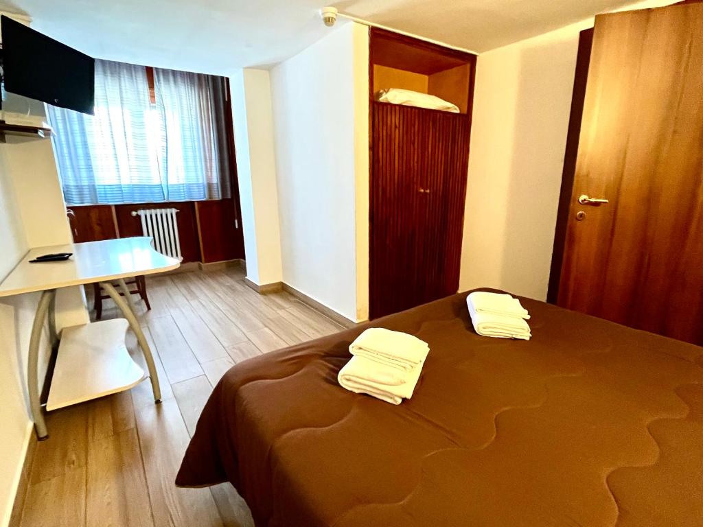 Posteľ alebo postele v izbe v ubytovaní Hotel Pinguino