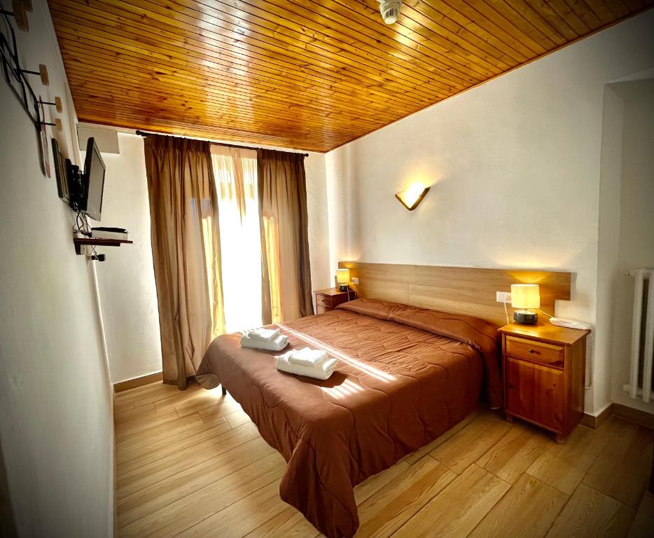 Posteľ alebo postele v izbe v ubytovaní Hotel Pinguino