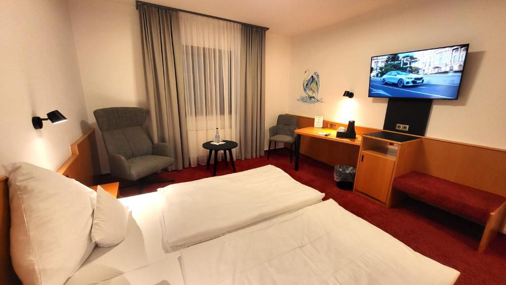 Postel nebo postele na pokoji v ubytování Hotel Schwanen