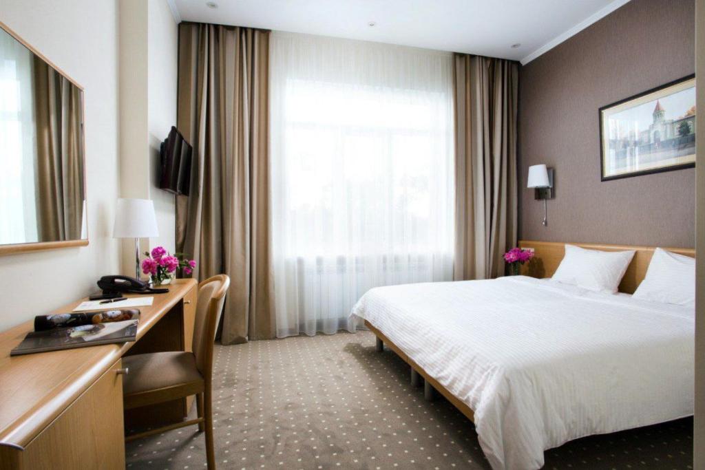 TV a/nebo společenská místnost v ubytování Alexandrovskiy Hotel