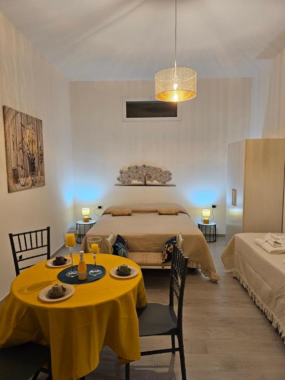 a bedroom with a bed and a table with food on it at Casa Miccio B&B in SantʼAngelo in Formis