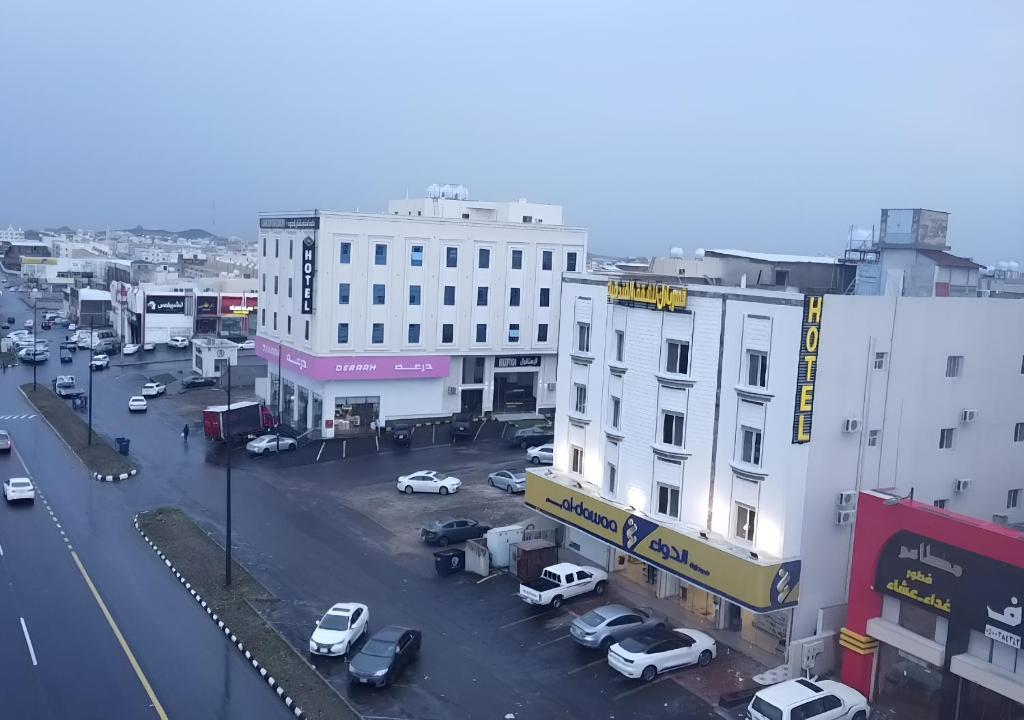 an overhead view of a city street with cars and buildings at قمم بارك Qimam Park Hotel 1 in Abha