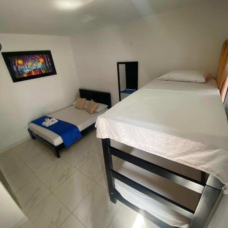 Postel nebo postele na pokoji v ubytování HOTEL LUZ MERY
