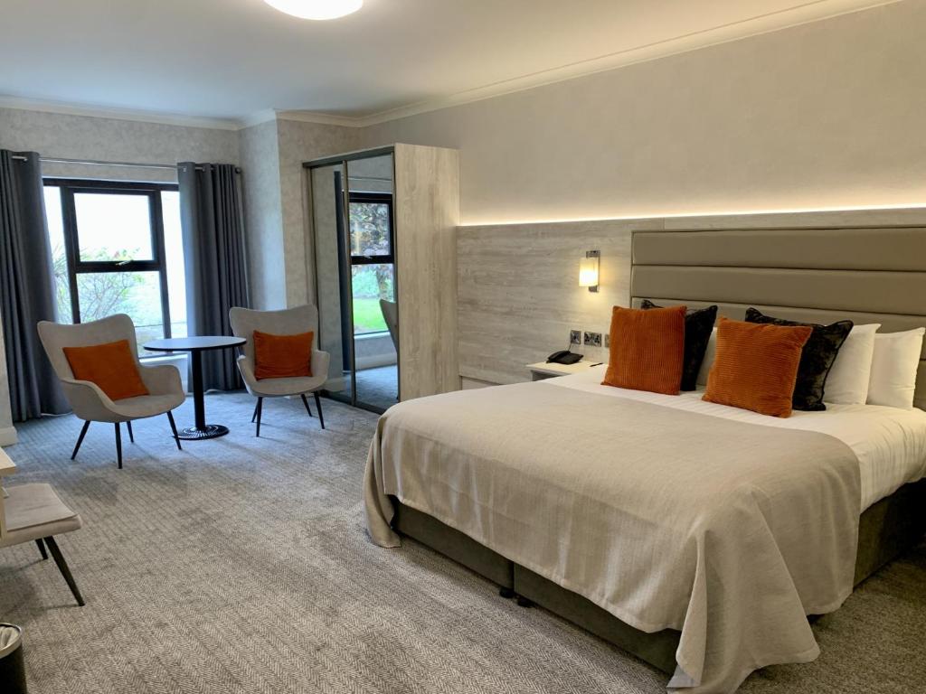 Postel nebo postele na pokoji v ubytování Mill Park Hotel