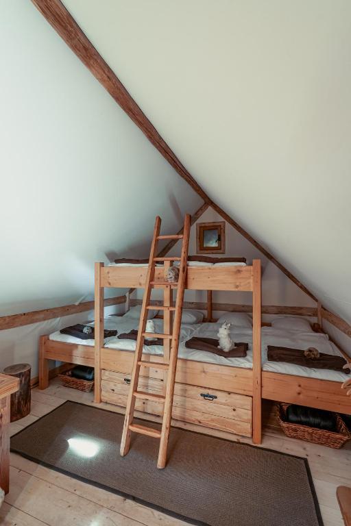 a room with two bunk beds in a attic at Altipik - Lodges Insolites in Mont-Saxonnex