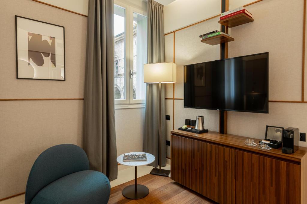 TV a/nebo společenská místnost v ubytování Hotel Brun