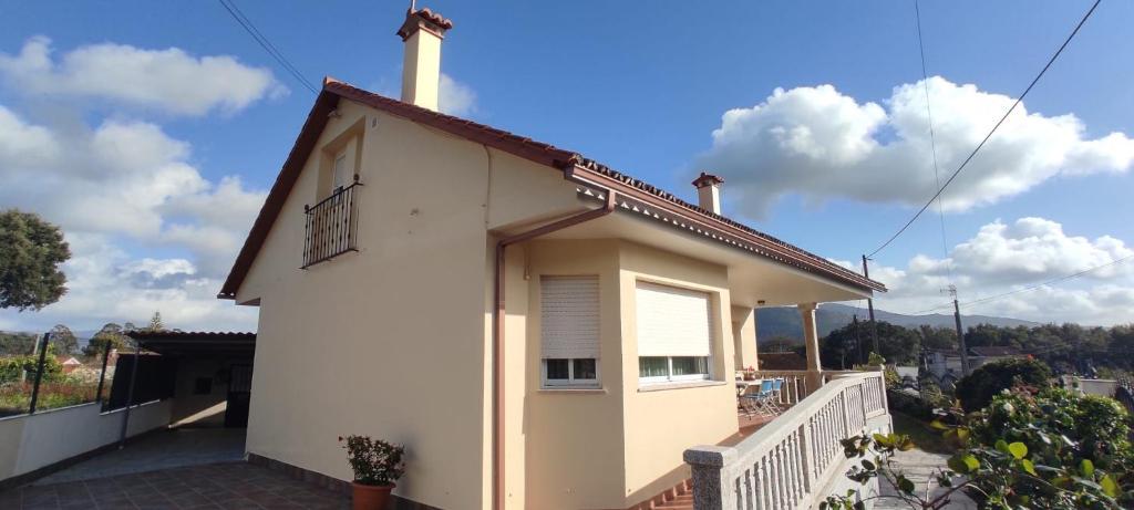 a small white house on a balcony with a view at RINCÓN DEL MIÑO in Tomiño