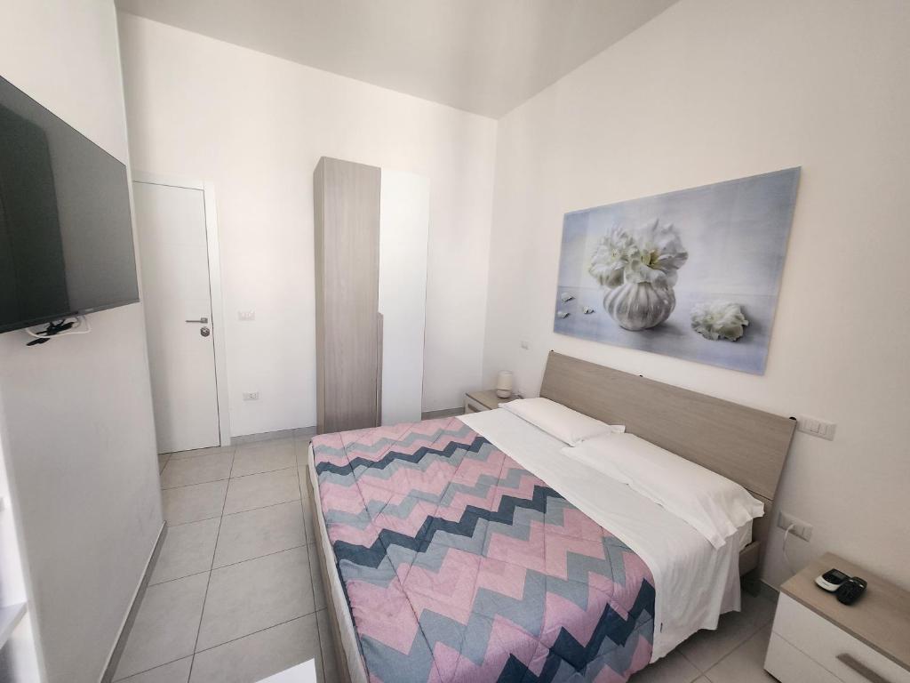 Postel nebo postele na pokoji v ubytování Dimora Rudiae