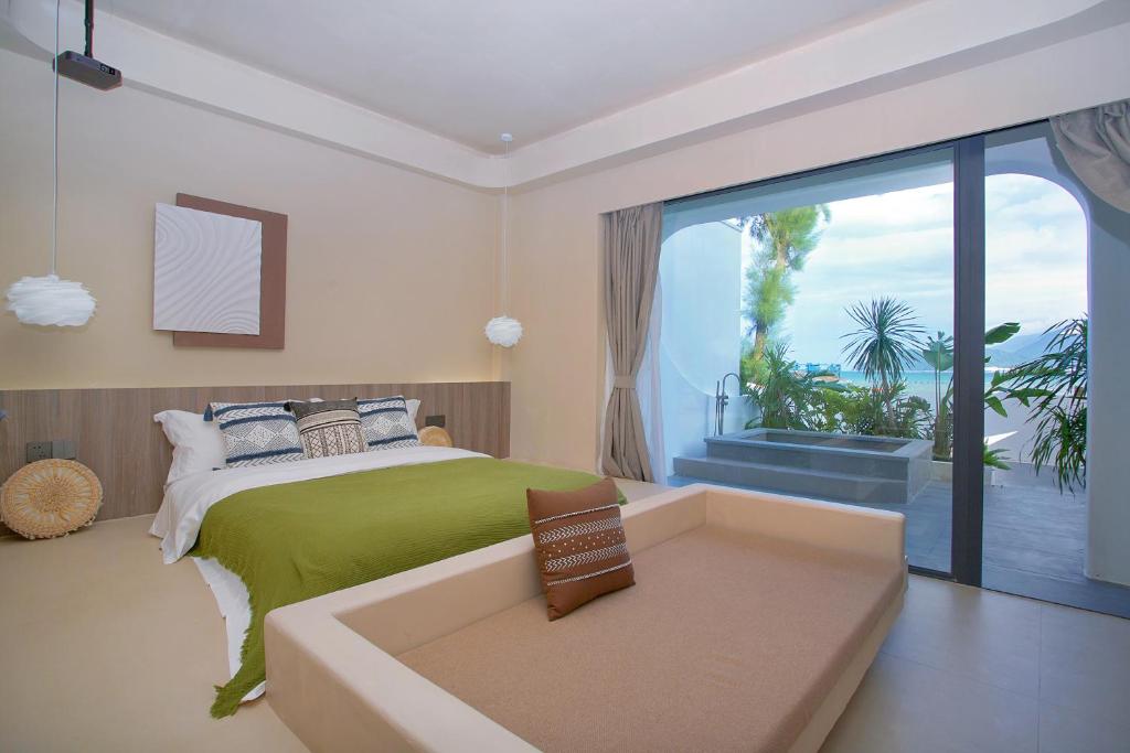 Postel nebo postele na pokoji v ubytování Shenzhen Semporna Beach Sea View B & B - 深圳较场尾仙本那沙滩海景民宿