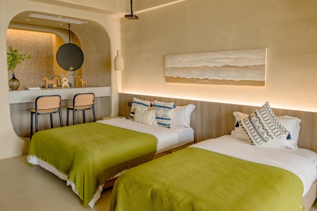 Postel nebo postele na pokoji v ubytování Shenzhen Semporna Beach Sea View B & B - 深圳较场尾仙本那沙滩海景民宿
