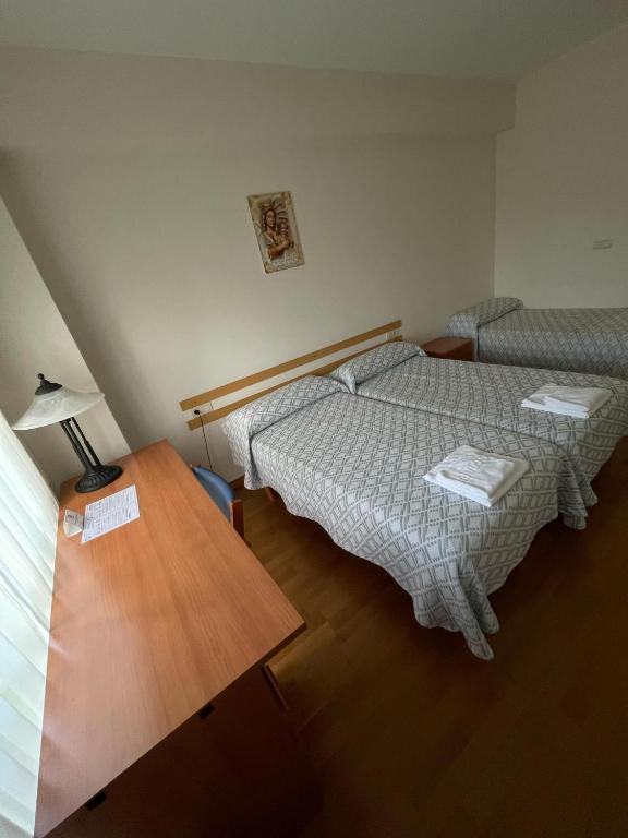 Posteľ alebo postele v izbe v ubytovaní Casa Diocesana VIA LUCIS