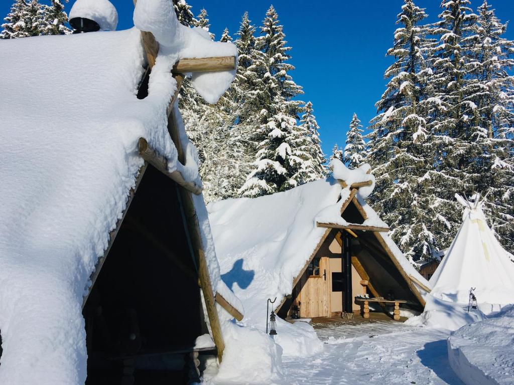 a cabin in the snow with a teepee at Altipik - Lodges Insolites in Mont-Saxonnex