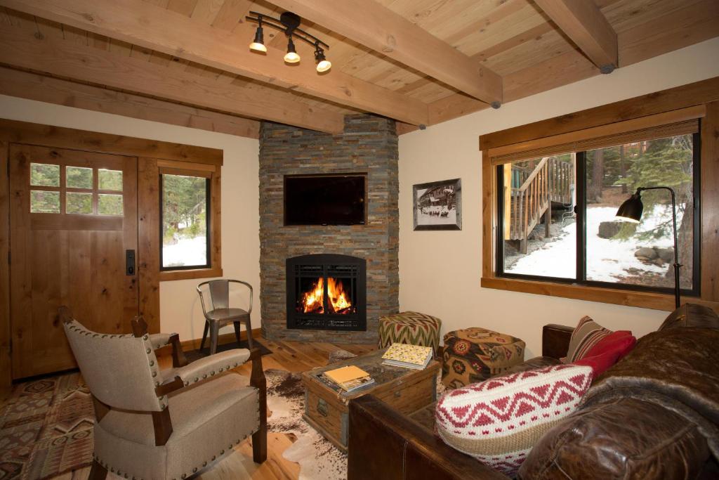 a living room with a couch and a fireplace at Allenby- LuxuryCabin w Cozy Fireplace, Near Northstar! in Tahoe Vista