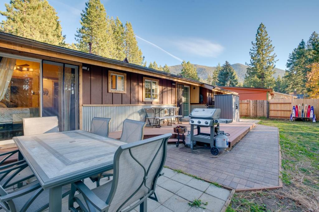 a patio with a table and chairs and a house at Stateline Home about 2 Mi to Tahoe Beaches in Stateline