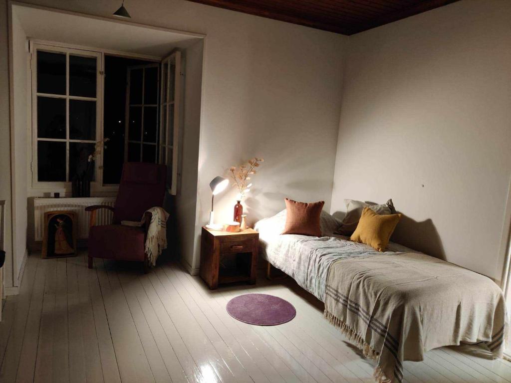 Кровать или кровати в номере Warkhaus Apartments Korpela