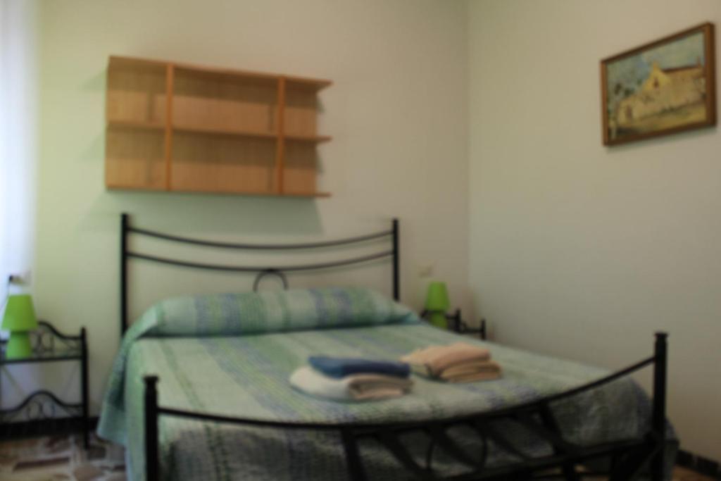 A bed or beds in a room at Alghero Budget