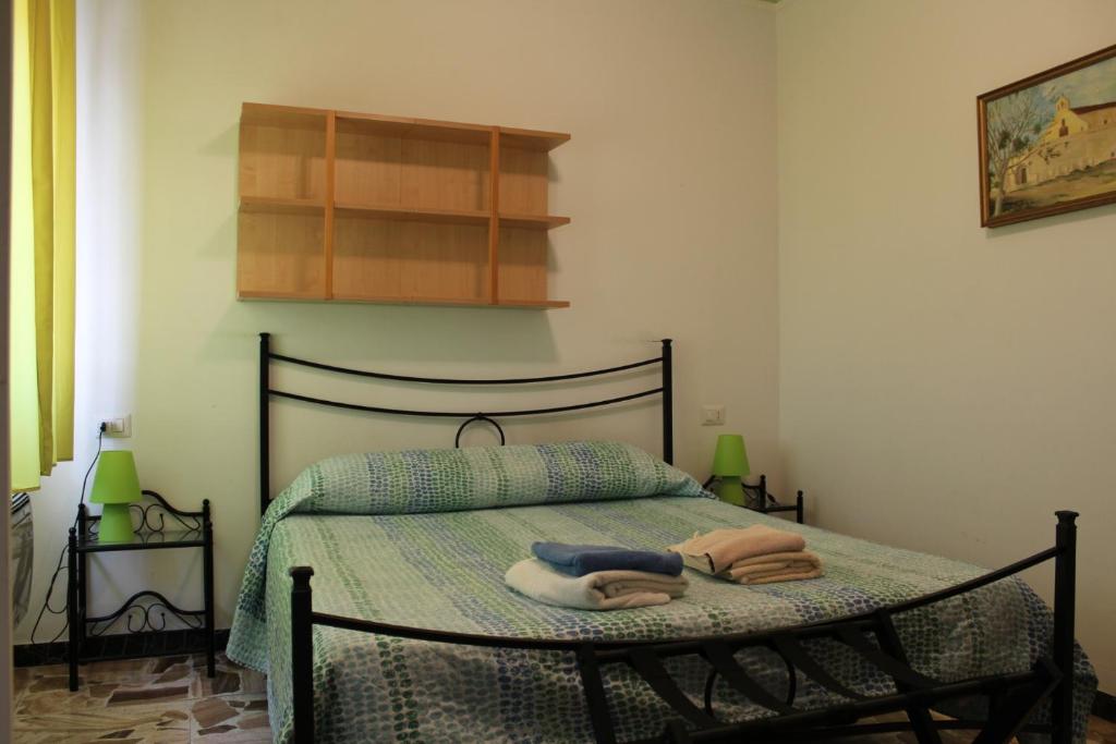 A bed or beds in a room at Alghero Budget