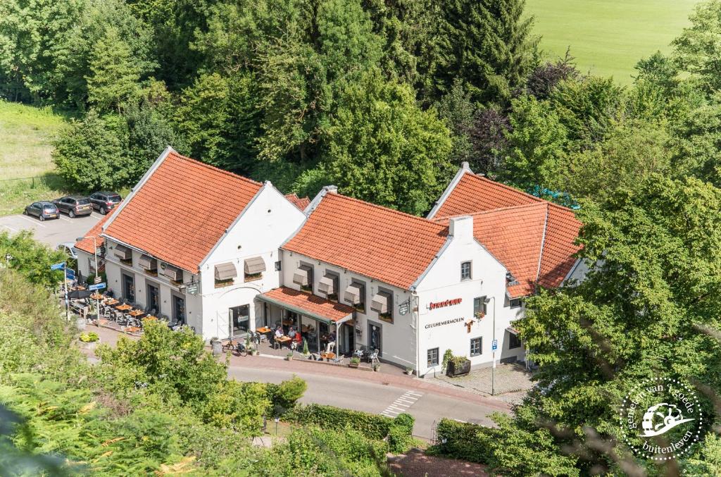 an overhead view of a building with orange roofs at Herberg de Geulhemermolen in Berg en Terblijt