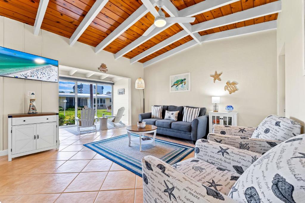 a living room with a couch and a table at Casa Mar by Beachside Management in Sarasota