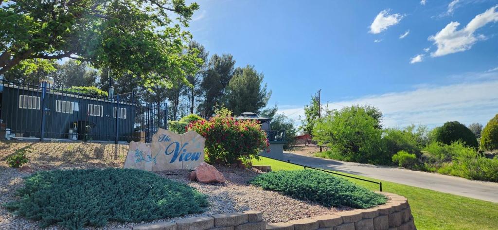 a sign that says the view in a yard at The View Motel in Cottonwood