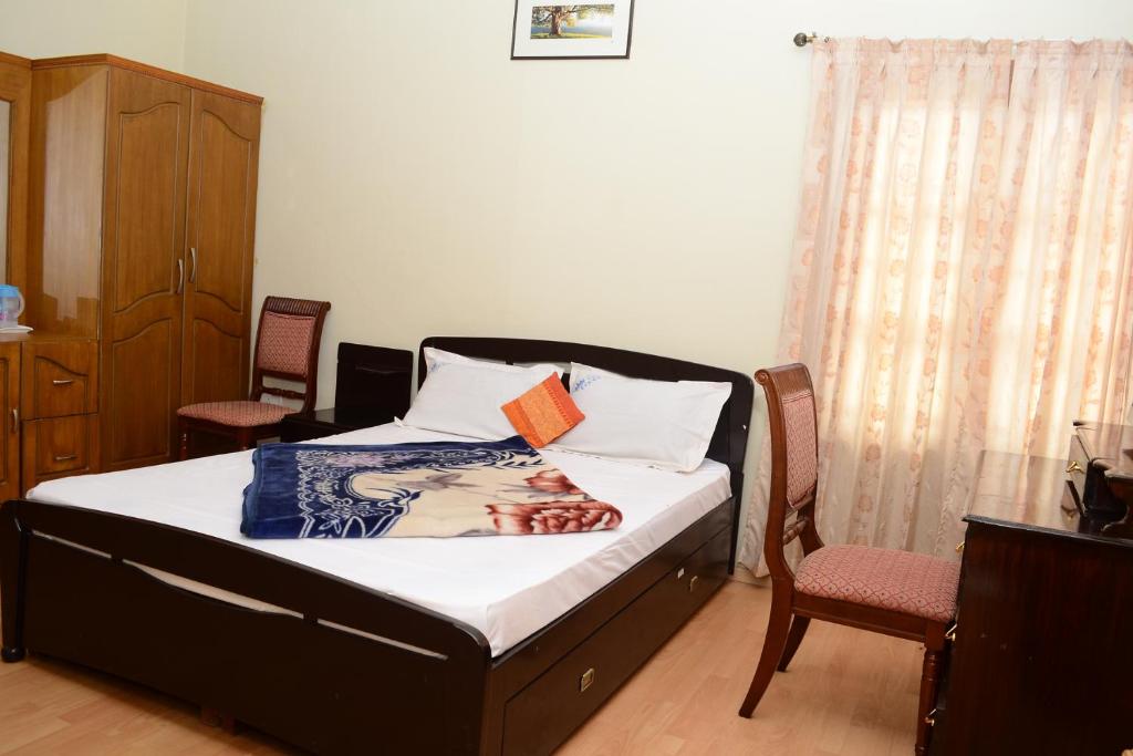 Postel nebo postele na pokoji v ubytování Rainbow Cottages-Budget Friendly rooms