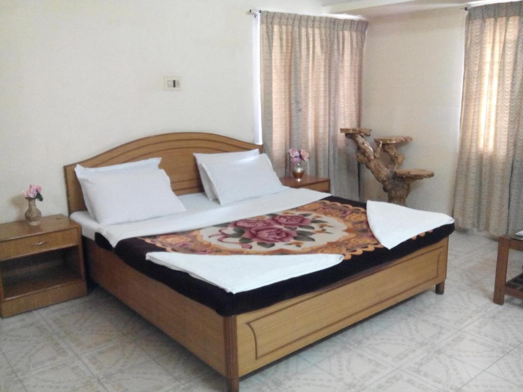 Postel nebo postele na pokoji v ubytování Rainbow Cottages-Budget Friendly rooms