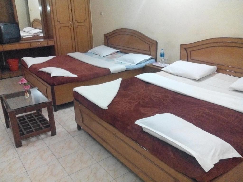 Postel nebo postele na pokoji v ubytování Rainbow Cottages-Budget Friendly rooms