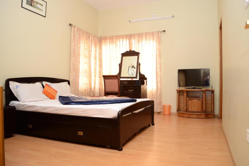 Postel nebo postele na pokoji v ubytování Rainbow Cottages-Budget Friendly rooms