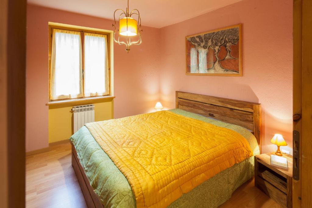 Postel nebo postele na pokoji v ubytování La Fleur, Morgex