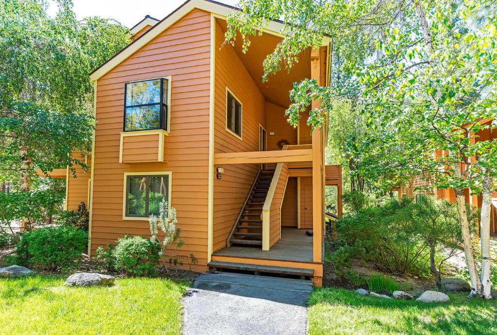 a tiny house with a staircase in a yard at 107 McCloud - Highly Sought After Complex in Incline Village