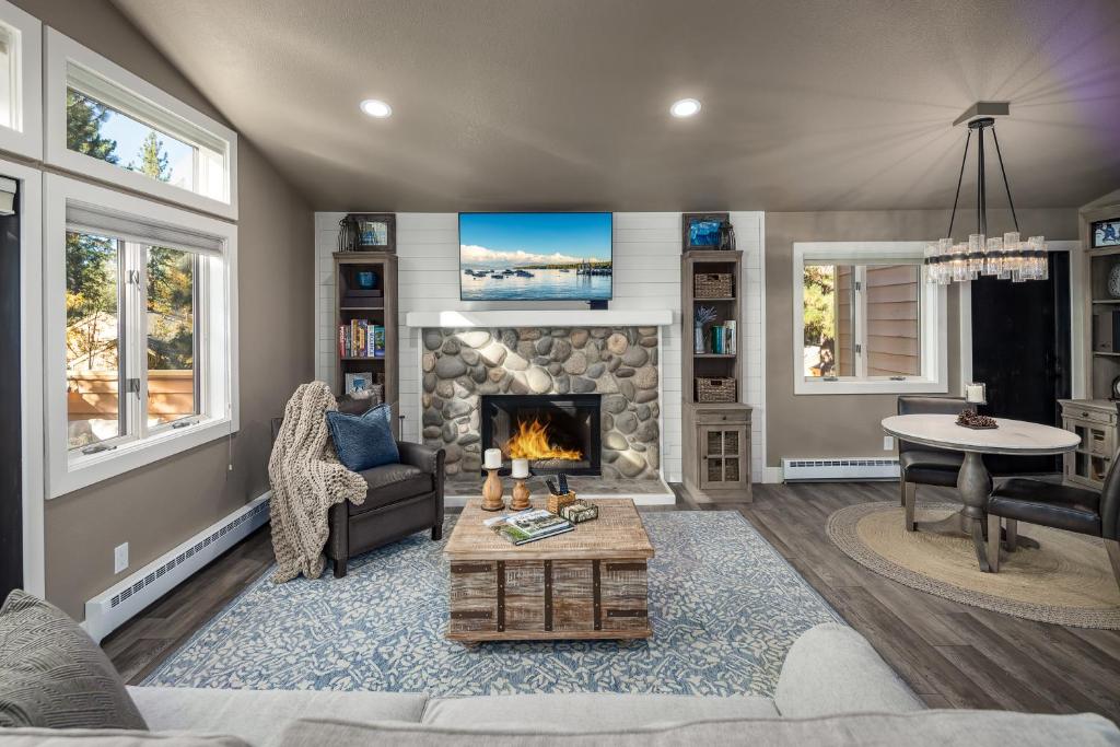 a living room with a fireplace and a couch at 128 McCloud - Luxury Couples Retreat in Incline Village