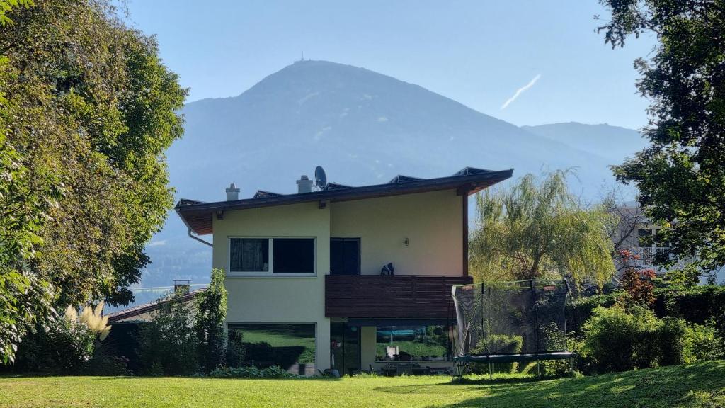 a house with a mountain in the background at Studio Bike & Snow in Innsbruck