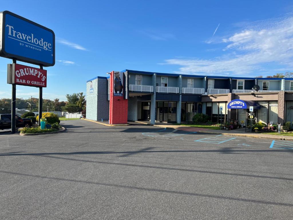 an empty parking lot in front of a hotel at Travelodge by Wyndham Aberdeen in Aberdeen