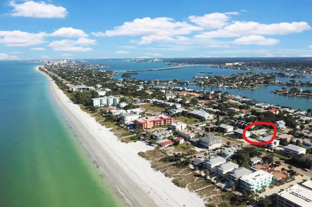 an aerial view of a beach with a red circle at Pelican Beach Studio #8 in Clearwater Beach