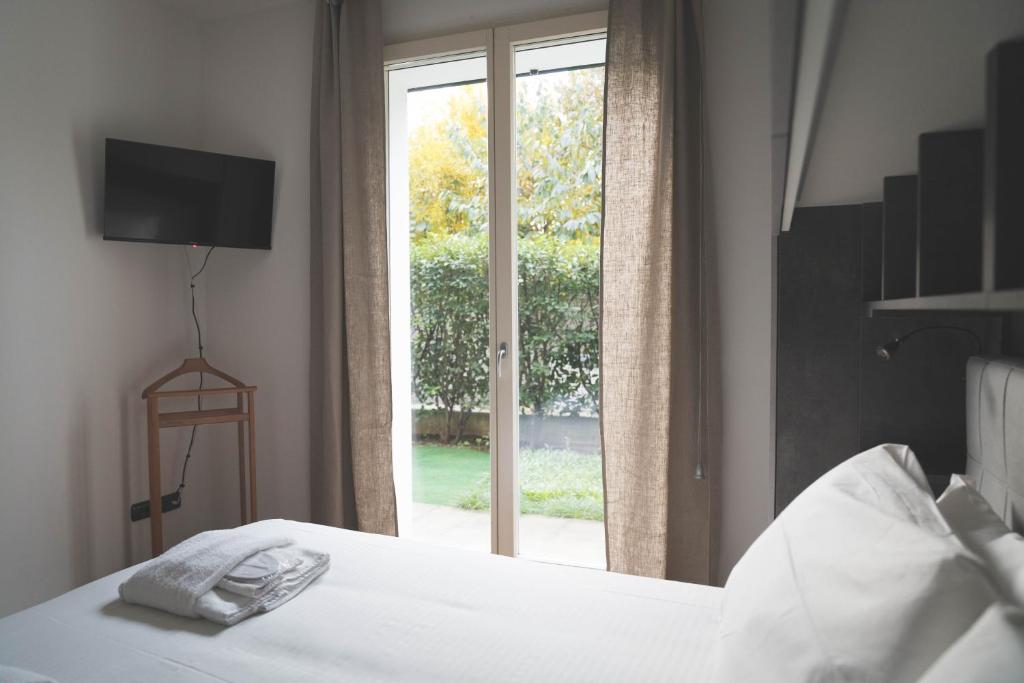 Ліжко або ліжка в номері L'Archè Comfort & Relax - House with garden