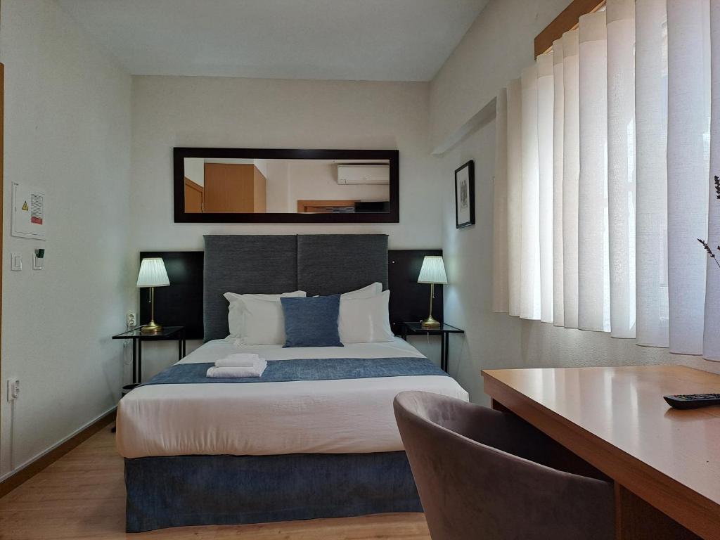 Ein Bett oder Betten in einem Zimmer der Unterkunft Hotel SQUARE