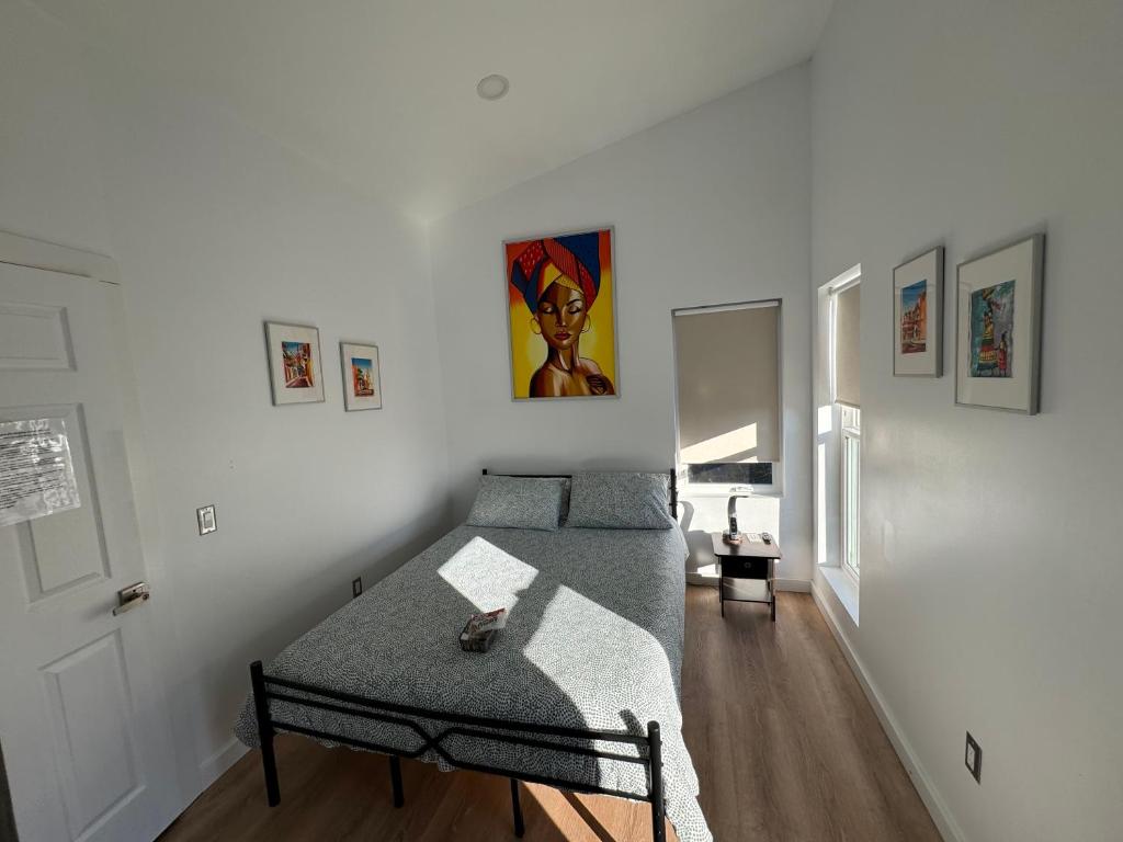 a bedroom with a bed and a table in it at Cartagena Room in Seattle