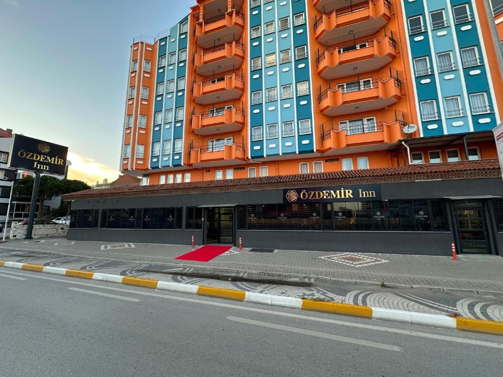a tall building with an empty street in front of it at Özdemir Inn Otel in Balıkesir