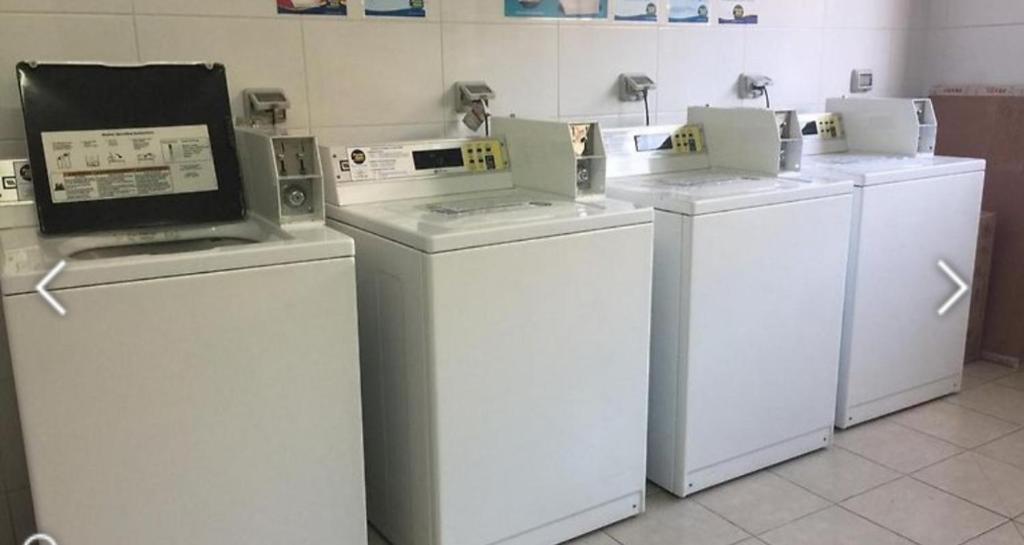 a row of washers and dryers in a room at San francisco 335/317 in Santiago