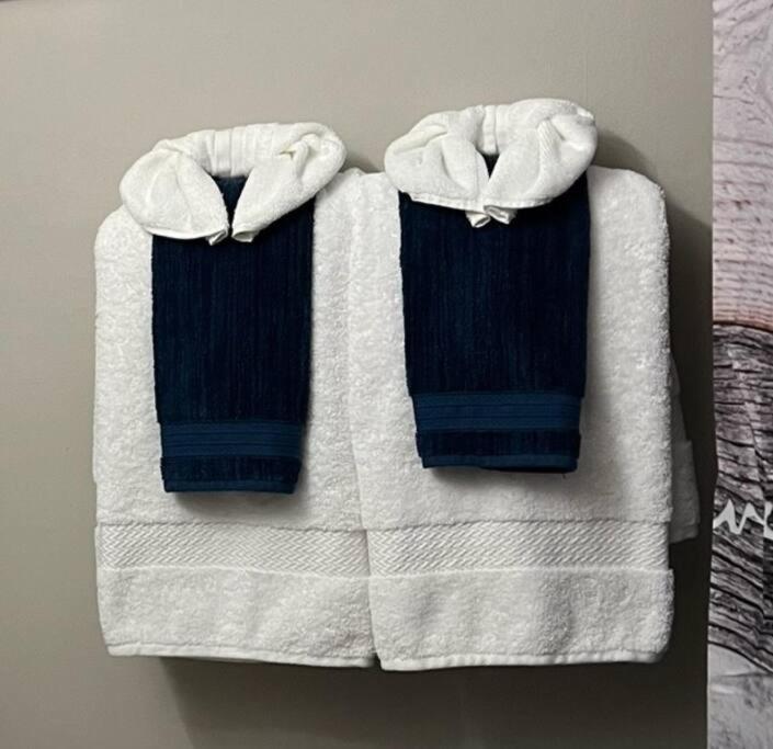 two towels are sitting on top of a bed at Casa Azul in Bracebridge