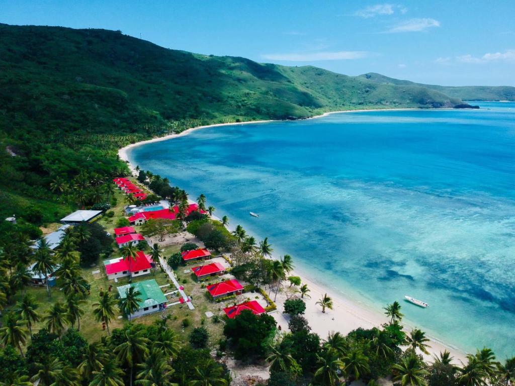 an aerial view of a beach with tents and the ocean at Korovou Eco Tour Resort in Naviti Island