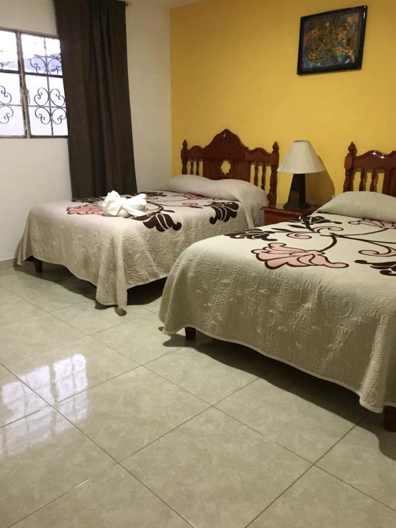 Postel nebo postele na pokoji v ubytování Hotel Posada Camelinas