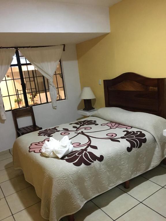 Postel nebo postele na pokoji v ubytování Hotel Posada Camelinas