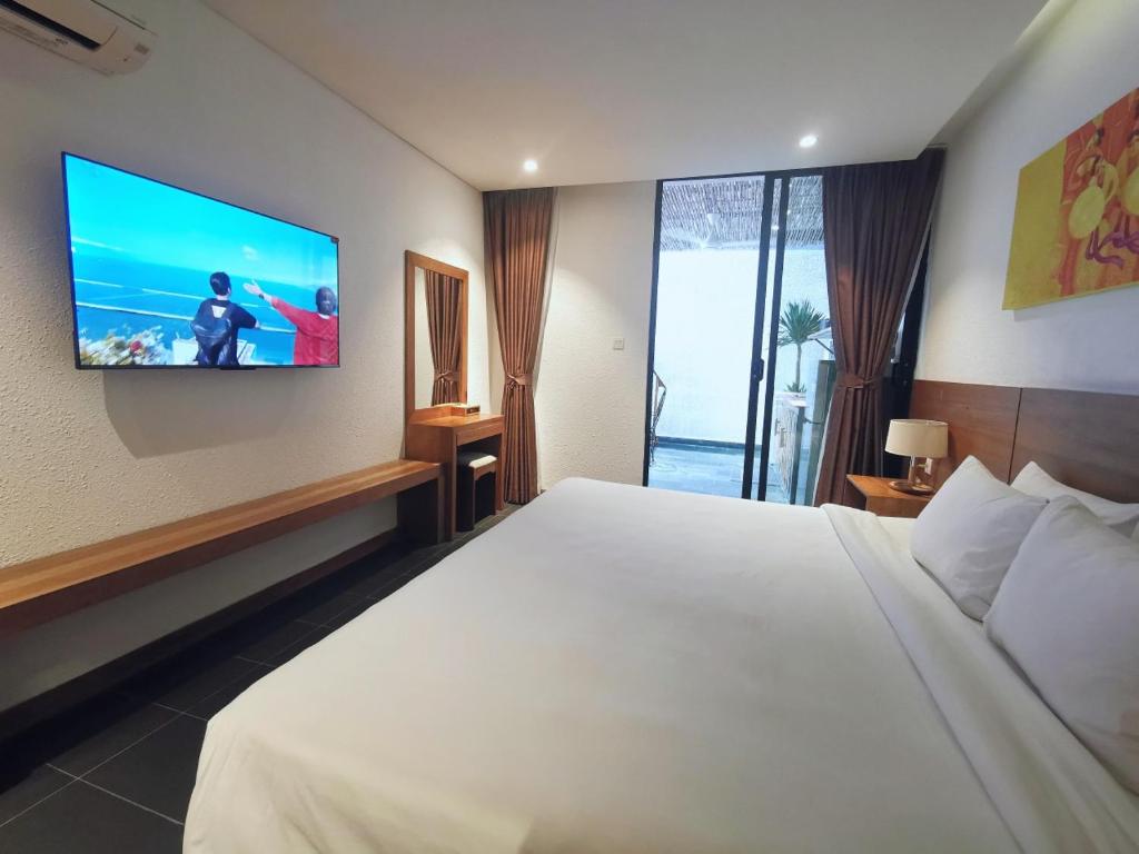 TV a/nebo společenská místnost v ubytování Maple Hotel & Apartment